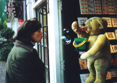 Joy and bubble blowing bear