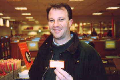 Tom in Easy Internet cafe with his ticket for 110 minutes of use